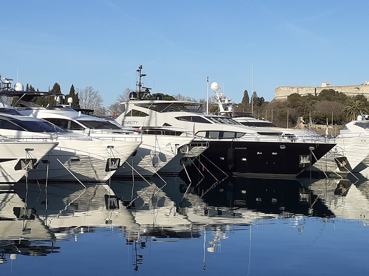 Superyachts stern-to at Port Vauban, Antibes — where the brokerage market actually lives.