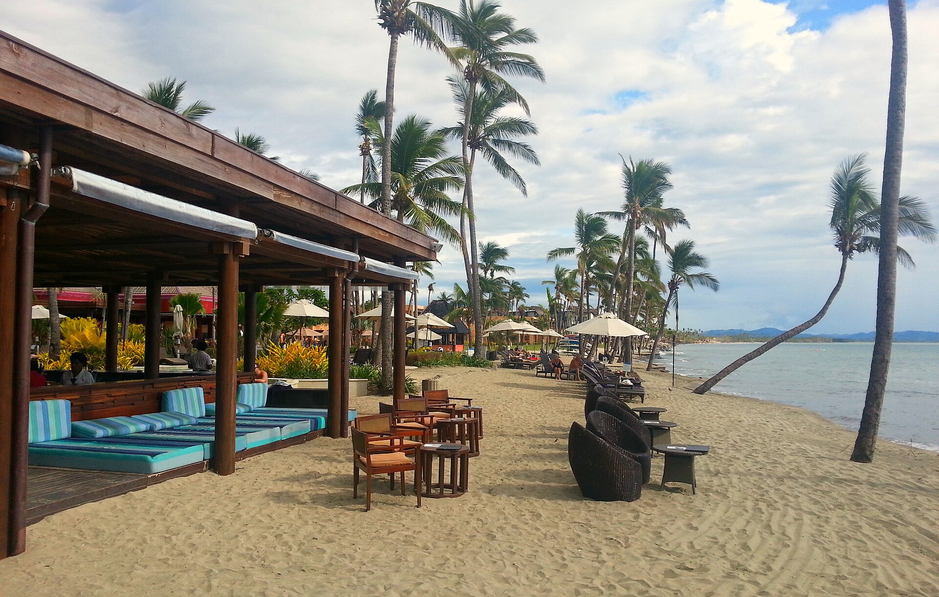Beachfront bar and palms at a Denarau Island resort, Fiji