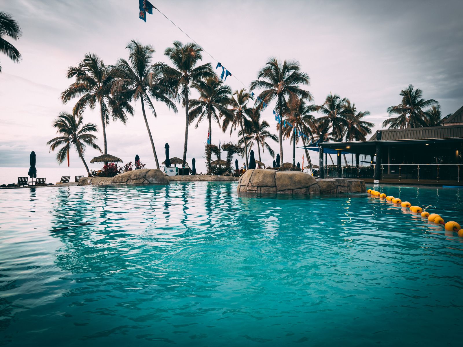 Palm-lined infinity pool at a luxury Fiji resort