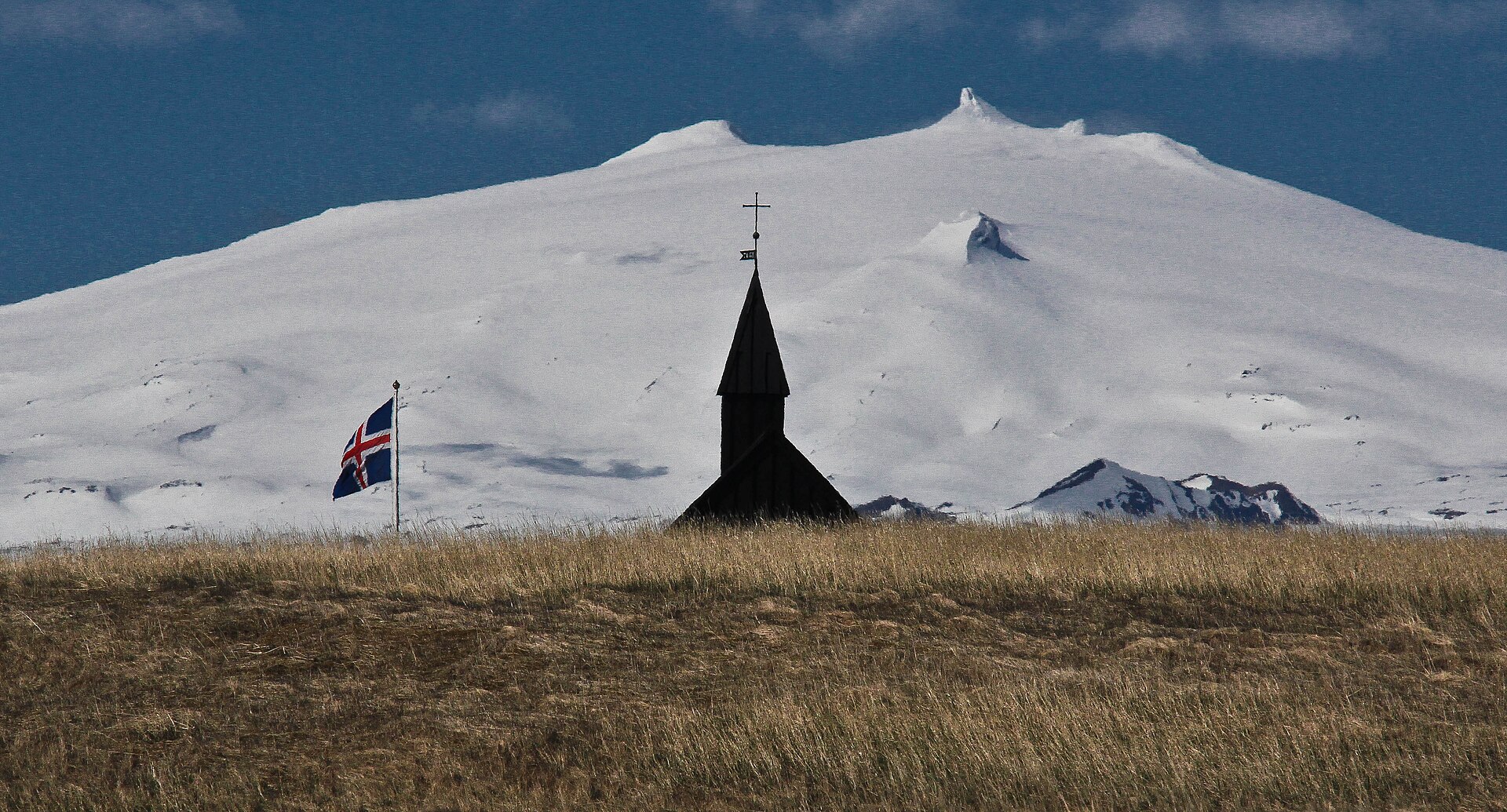 The black church at Búðir with the Snæfellsjökull ice cap behind