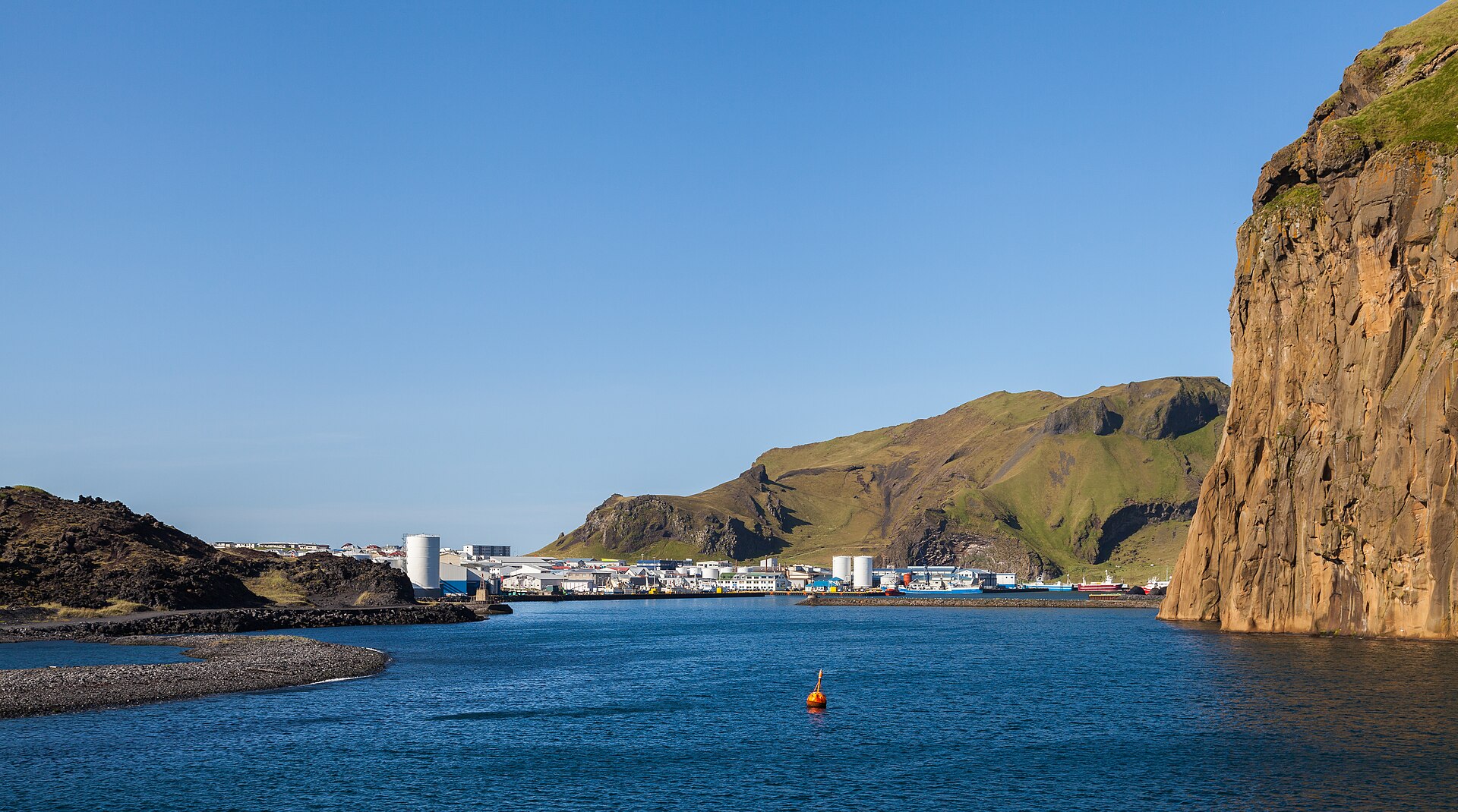 The natural harbour of Heimaey, Westman Islands, walled by sea cliffs