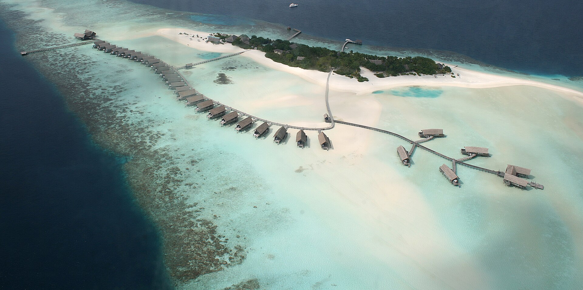 Aerial view of a small island on a coral reef in the Maldives