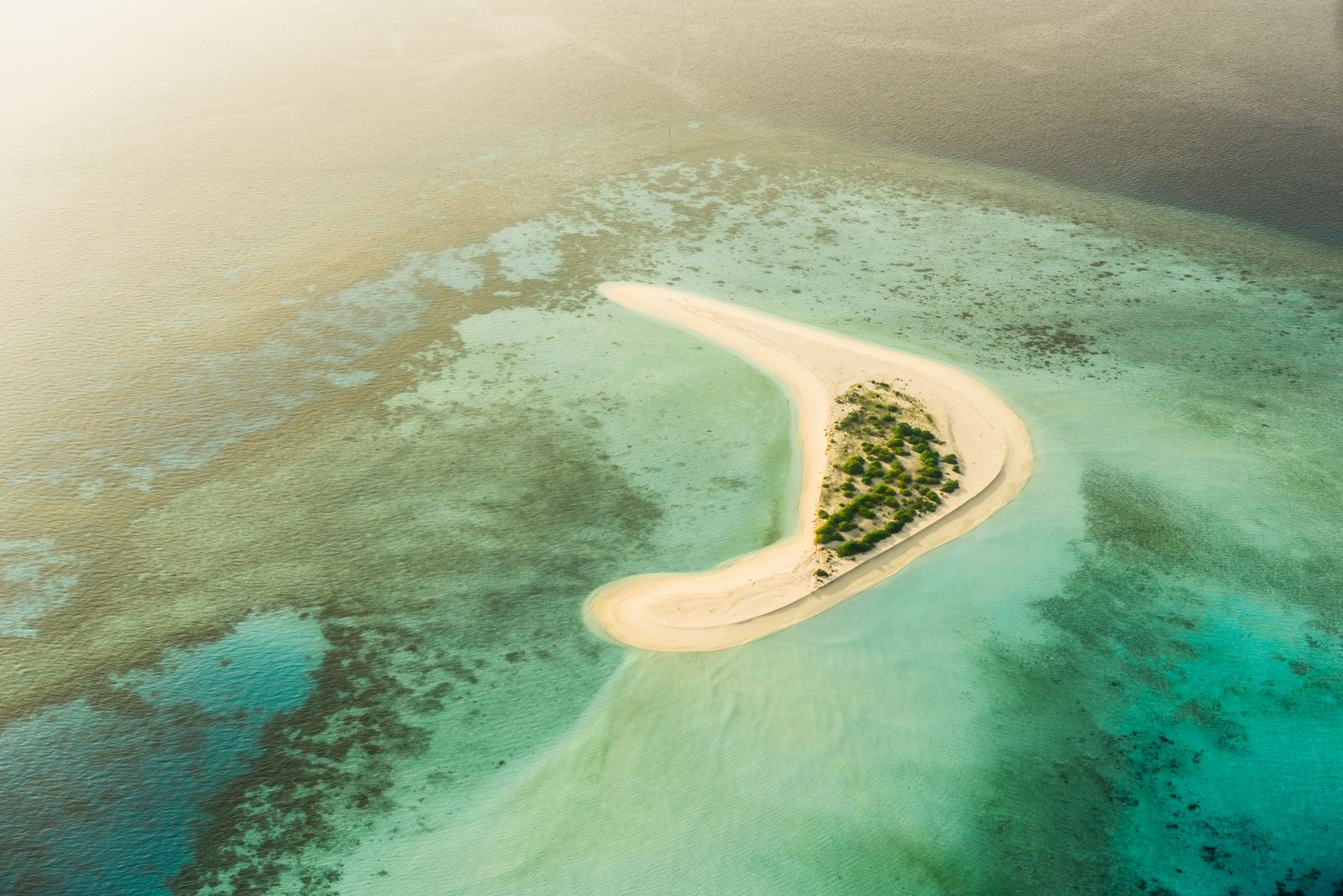 Secluded sandbank surrounded by turquoise water in the Maldives