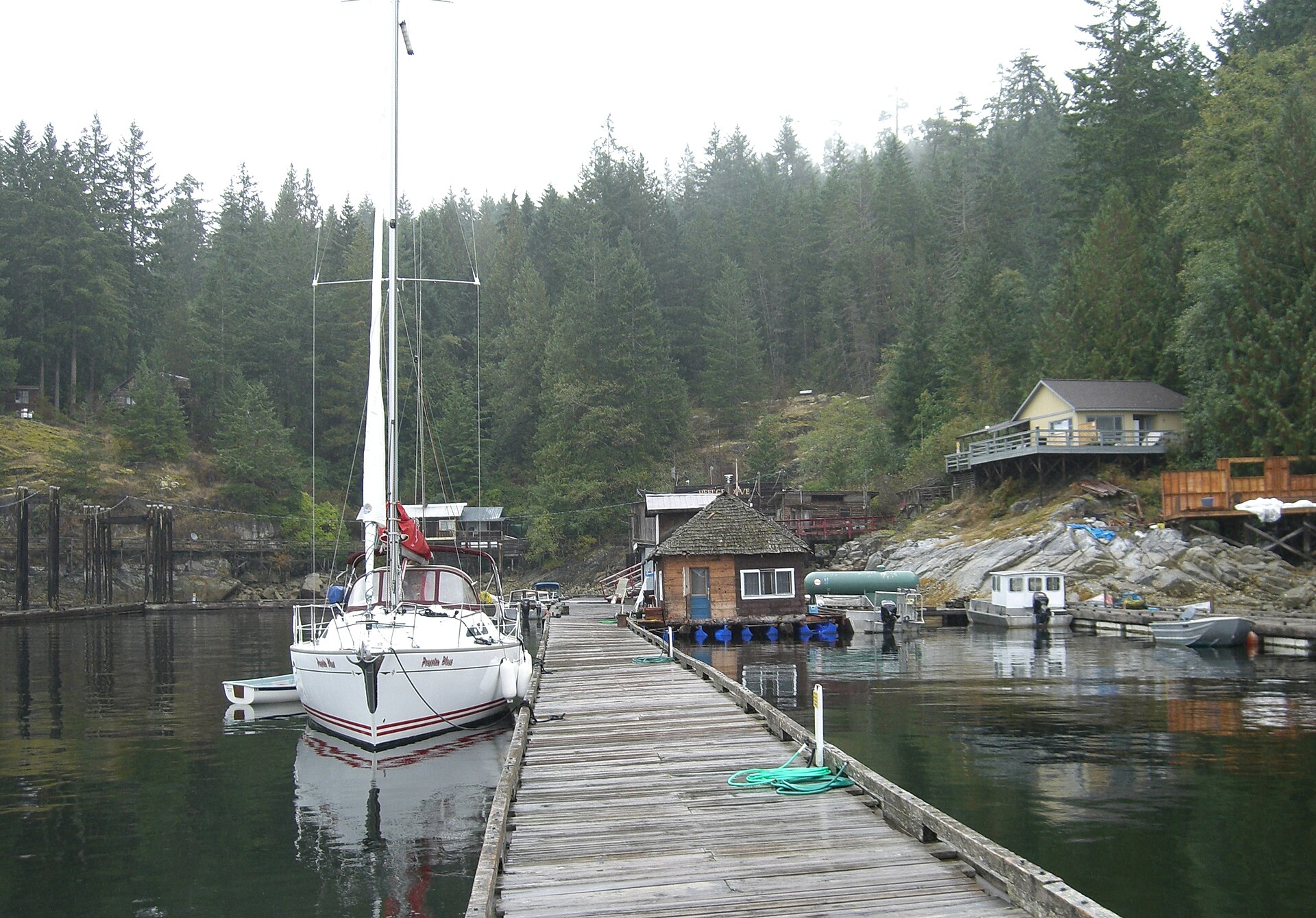A sailboat moored at the dock in Refuge Cove, West Redonda Island