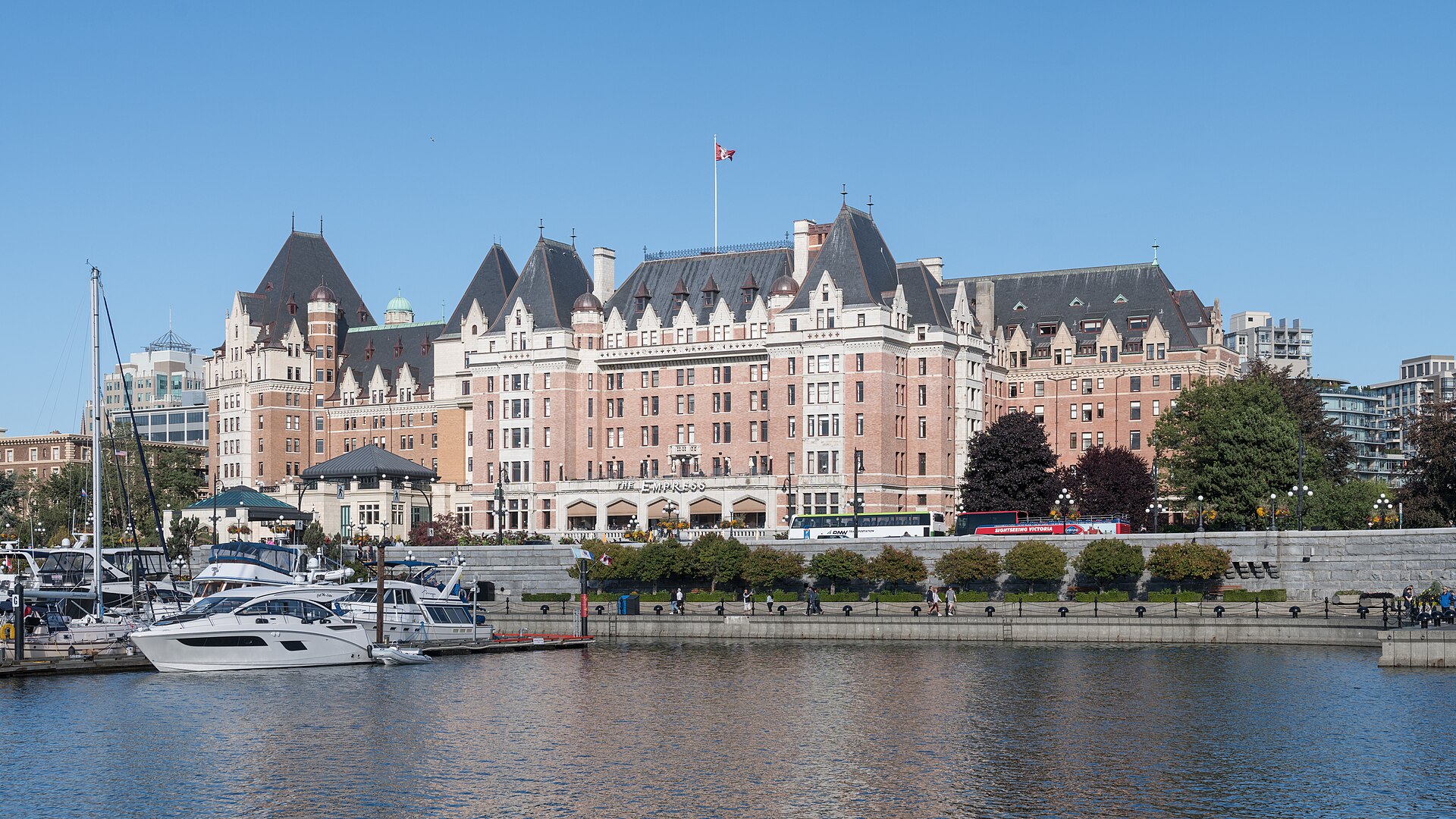 The Fairmont Empress hotel above Victoria's Inner Harbour, with boats moored below