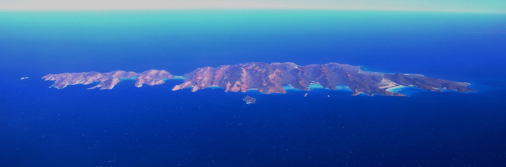Isla Espíritu Santo and Isla Partida from the air, deep blue sea around