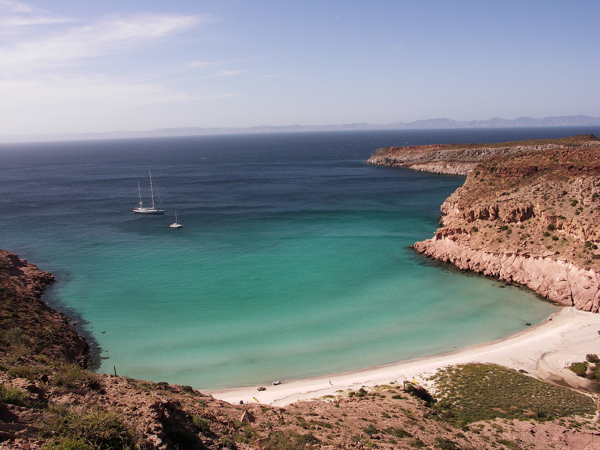 Yachts at anchor in the turquoise cove of Ensenada Grande, Isla Partida